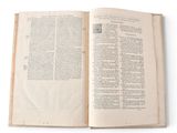 an open book that is sitting on a table