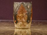 a vase that is sitting on a table in a room