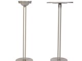 pair of stainless steel pedestals with a round top