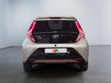 the rear end of a white toyota c - hr in a white room