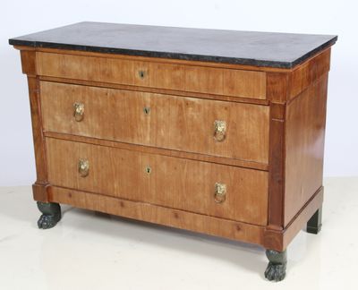 a wooden chest of drawers with a marble top