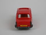 a red toy car that is sitting on a white surface