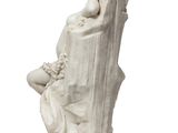 marble statue of a woman reading a book on a chair