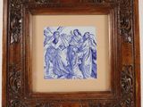 a framed picture of a blue and white picture of a group of people