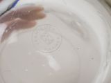 a close up of a glass of water with a blue and white striped straw