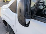a close up of a side view mirror of a truck