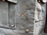 a close up of a jacket with buttons on it