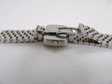 a close up of a metal bracelet with a buckle on it