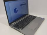 a laptop computer sitting on a table with a blue screen