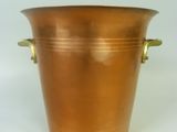 an image of a large copper pot with handles on a white background