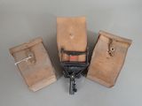 three pieces of luggage sitting next to each other on a table
