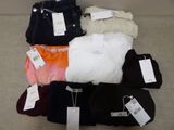 a pile of clothing that is sitting on the floor