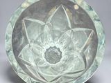 a glass plate with a flower inside of it