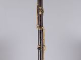 a close up of a bassoon on a clear stand