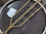 a close up of a metal object with a wire attached to it
