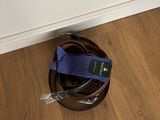 an image of a pair of shoes and a belt on the floor