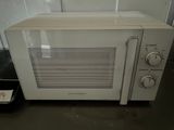 a microwave that is sitting on a counter in a kitchen