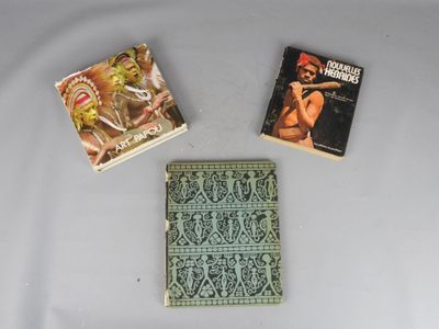 three books that are sitting on a table