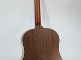 a close up of an acoustic guitar on a white background