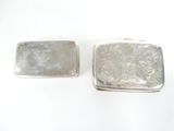 pair of silver plated purses on a white background