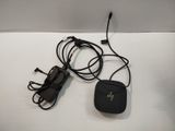 a small black box with a charger attached to it