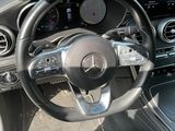 the interior of a car with a steering wheel and dashboard controls
