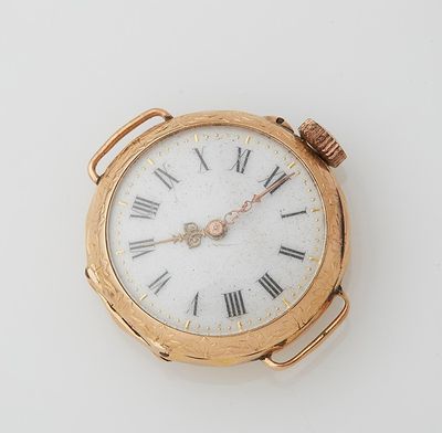 a gold pocket watch with roman numerals on the face