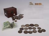 a small wooden box with coins and a small box with money