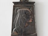 an image of a silver pendant with a woman ' s face on it