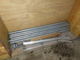 a picture of a room that has a bunch of pipes on the floor