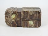 a small wooden box with a handle on a white surface