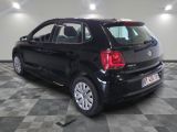 a picture of a black car parked in a garage