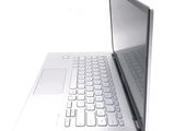 a laptop computer with a keyboard on a white surface