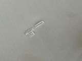 a close up of a metal object on a white surface