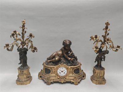 three different types of clocks on display on a table