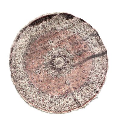 TAPIS en laine noué à la main de forme ronde à décor d'un éc…