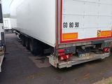 two trucks parked next to each other in a parking lot