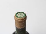 a close up of a bottle of wine on a table