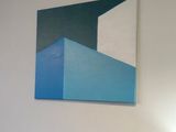 a painting on the wall above a bed in a room