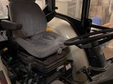 a picture of a seat on a tractor in a building