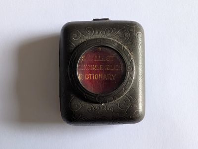 a small black box with a red light inside of it