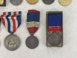 some of the medals and medals are on display on the table