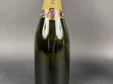 a close up of a bottle of champagne on a table