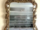 a mirror hanging on the wall in a room