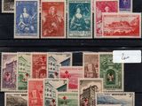 a collection of stamps from different countries on a black surface