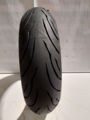 a close up of a motorcycle tire on a white surface
