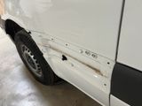 a white van with holes in the side of it