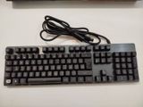 a computer keyboard and a mouse on a table