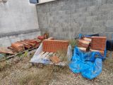 a pile of bricks sitting on the ground next to a building