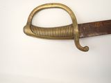 a very old sword that is on a table